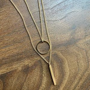 Gold double strand necklace with gold circle and gold bar